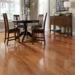 Flooring 124 Dark walnut solid wood flooring in a modern minimalist dining area.