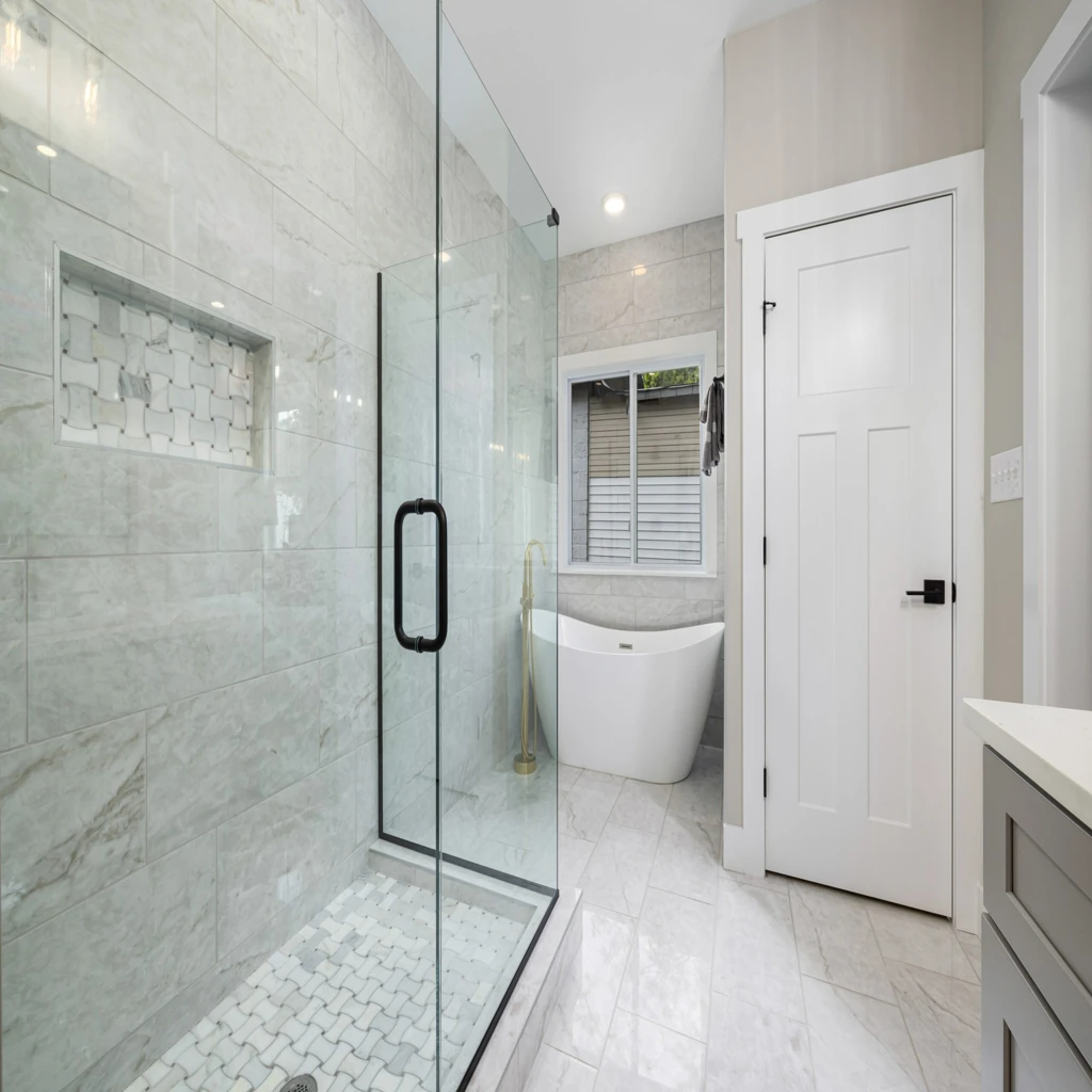 Bathroom Renovation 20 luxury-bathroom-with-frameless-glass-shower-partition-marble-wall-tiles-mosaic-shower-floor-and-freestanding-bath