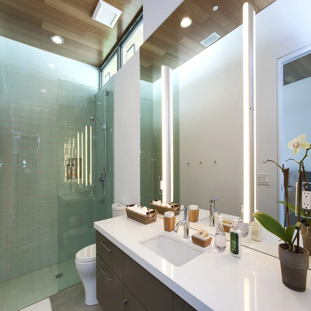 Bathroom Renovation 11 modern-bathroom-with-vertical-led-mirror-lights-recessed-spotlights-and-ceiling-ventilation-fan