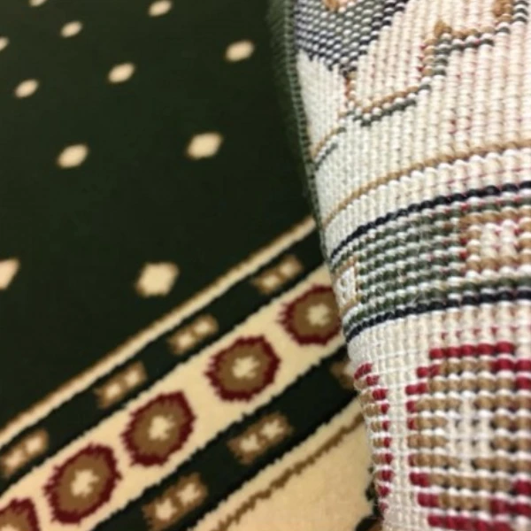 A close up view of Green Border Masjid Carpet