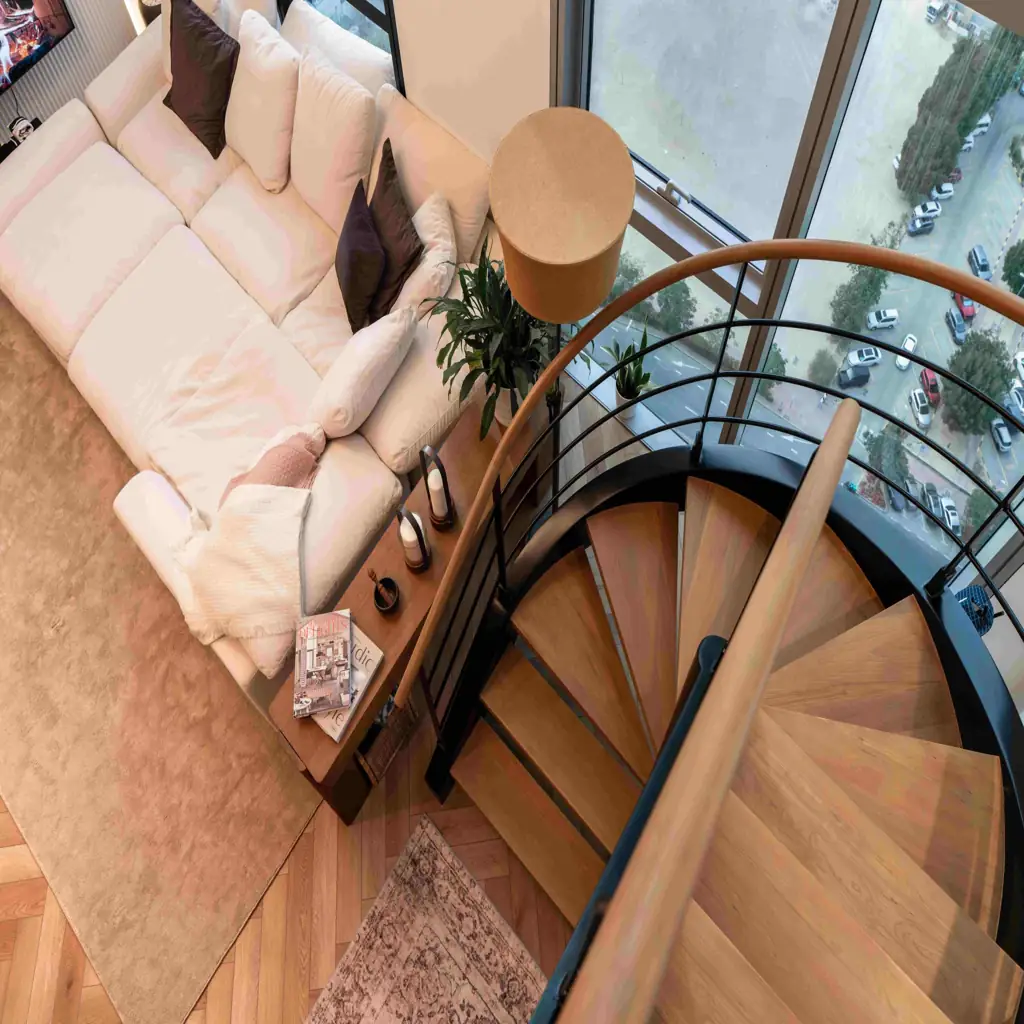 Aerial view of wood spiral staircase in modern duplex living room