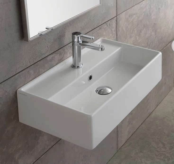 modern-rectangular-wall-hung-basin-with-chrome-monobloc-tap-against-grey-stone-effect-wall-tiles